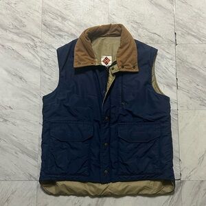 Vintage 80s Columbia Sportswear Men's Navy puffer vest with corduroy collar